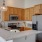 a kitchen with a stainless steel refrigerator