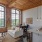 a large living room with a brick wall and a white couch